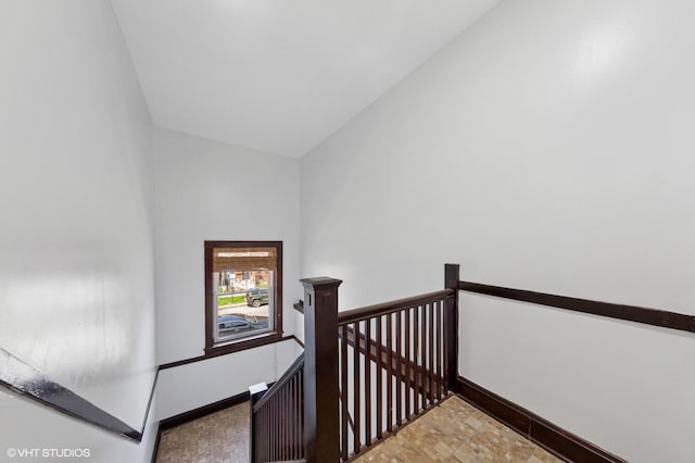stairs featuring baseboards