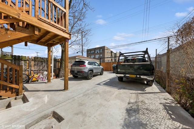 uncovered parking lot with fence
