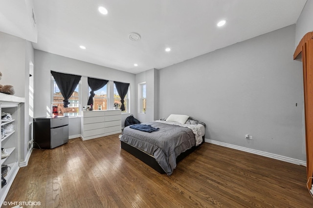 bedroom with recessed lighting, baseboards, and wood finished floors