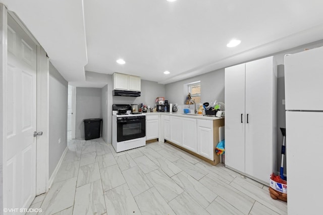 kitchen featuring light countertops, marble finish floor, freestanding refrigerator, under cabinet range hood, and gas range oven
