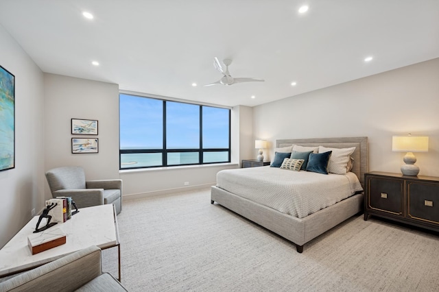 bedroom featuring recessed lighting, a ceiling fan, baseboards, and light colored carpet