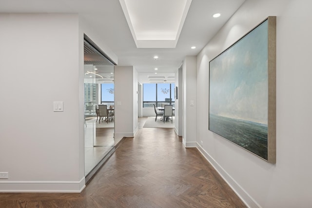 hallway with baseboards and recessed lighting