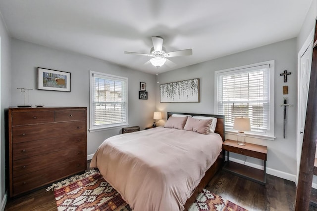 bedroom with baseboards, wood finished floors, and ceiling fan