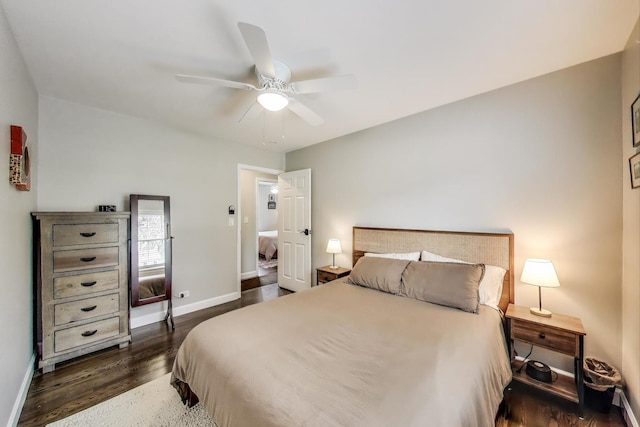 bedroom with dark wood finished floors, baseboards, and a ceiling fan