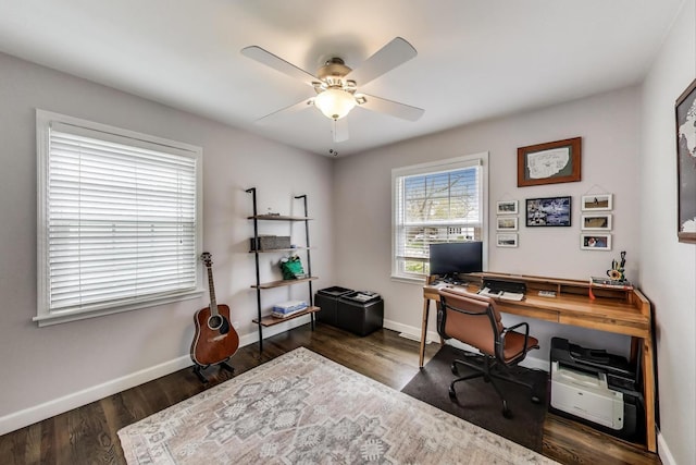 office space featuring ceiling fan, baseboards, and wood finished floors