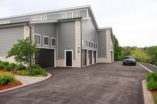 view of property exterior featuring aphalt driveway