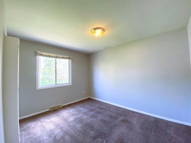 5210 Arquilla Dr, Richton Park, IL 60471 - spare room with baseboards, dark colored carpet, and visible vents