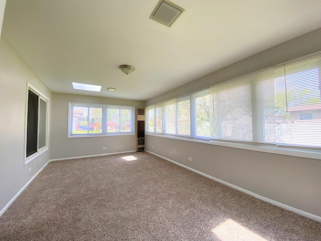 5210 Arquilla Dr, Richton Park, IL 60471 - carpeted empty room with a skylight, baseboards, and visible vents