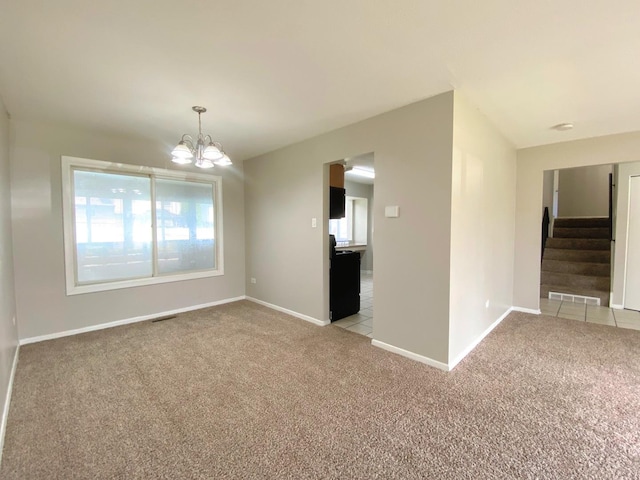 5210 Arquilla Dr, Richton Park, IL 60471 - empty room featuring an inviting chandelier, baseboards, visible vents, and light colored carpet