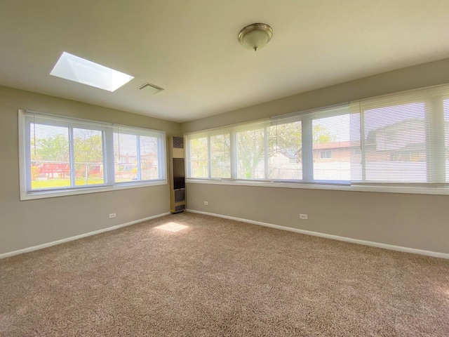 5210 Arquilla Dr, Richton Park, IL 60471 - carpeted spare room featuring a skylight, baseboards, and visible vents