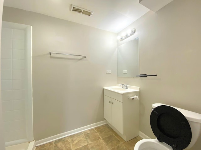 5210 Arquilla Dr, Richton Park, IL 60471 - full bathroom with visible vents, walk in shower, baseboards, vanity, and toilet