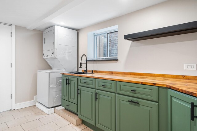 8543 S Laflin St, Chicago, IL 60620 - laundry area featuring cabinet space, stacked washer / drying machine, a sink, recessed lighting, and light tile patterned floors
