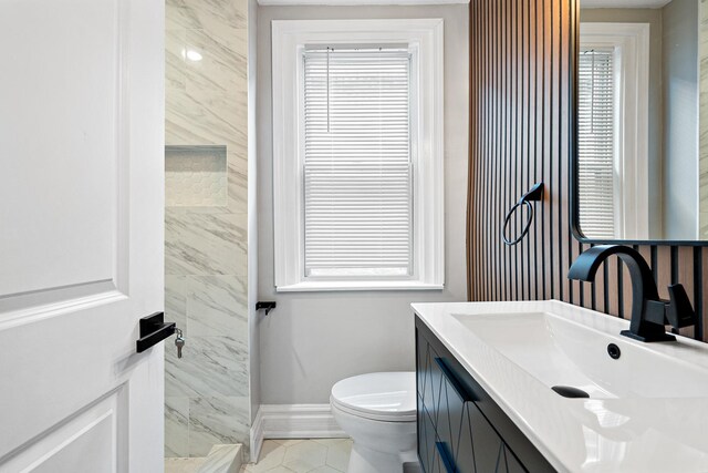 8543 S Laflin St, Chicago, IL 60620 - bathroom featuring baseboards, tile patterned floors, toilet, and vanity