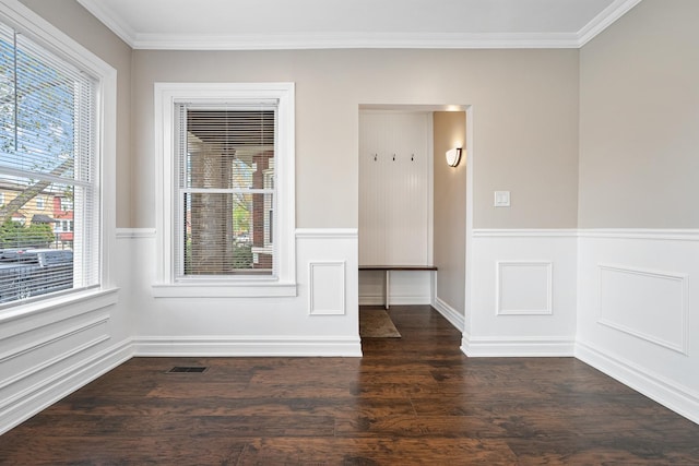 8543 S Laflin St, Chicago, IL 60620 - unfurnished room with visible vents, ornamental molding, a wainscoted wall, and dark wood-style floors