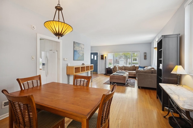1804 Cleveland St, Evanston, IL 60202 - dining space with light wood-style flooring and visible vents