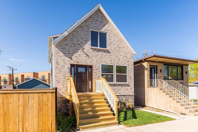 4134 W Roscoe St, Chicago, IL 60641 - view of front facade featuring brick siding and fence