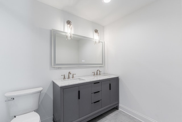 4134 W Roscoe St, Chicago, IL 60641 - bathroom with baseboards, toilet, double vanity, and tile patterned flooring
