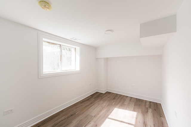 4134 W Roscoe St, Chicago, IL 60641 - empty room featuring wood finished floors and baseboards