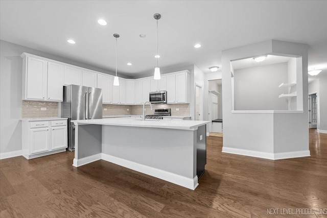 719 Foxborough Rd, South Elgin, IL 60177 - kitchen with appliances with stainless steel finishes, dark wood-style flooring, light countertops, white cabinets, and recessed lighting