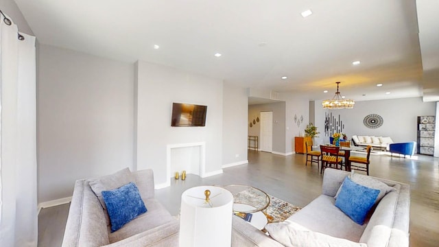 living room with an inviting chandelier, baseboards, and recessed lighting