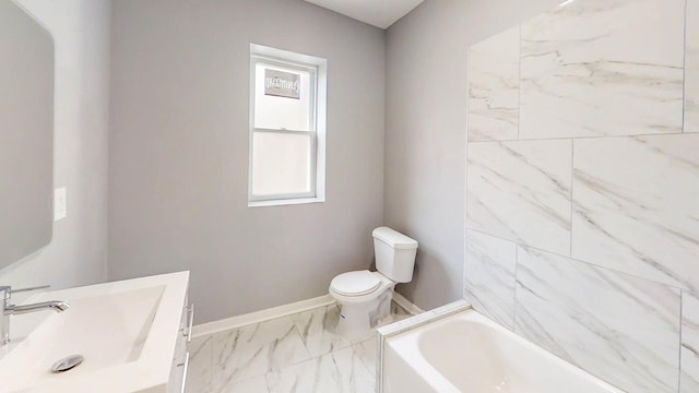 full bathroom with a bathtub, toilet, marble finish floor, baseboards, and vanity