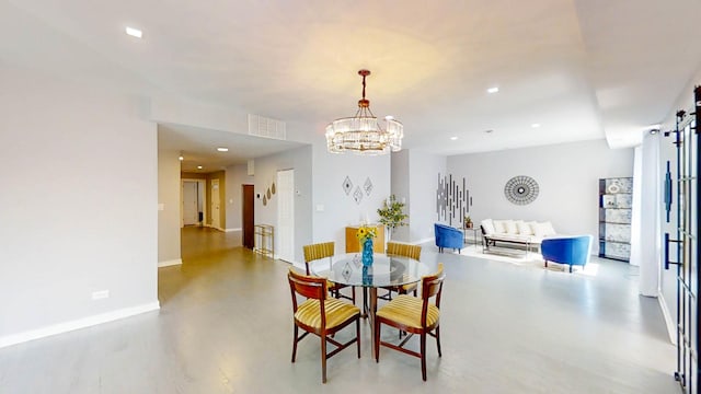 dining area with a notable chandelier, visible vents, a barn door, baseboards, and recessed lighting