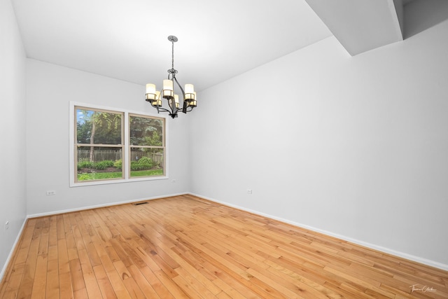 849 Brompton Cir, Bolingbrook, IL 60440 - spare room with a chandelier, baseboards, and light wood finished floors