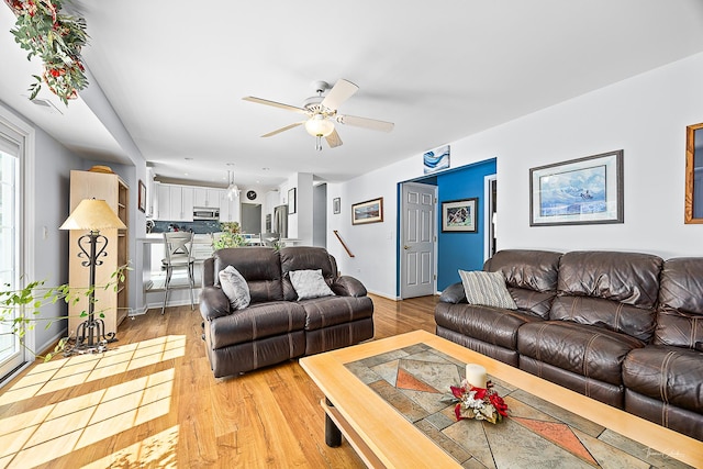 849 Brompton Cir, Bolingbrook, IL 60440 - living room featuring ceiling fan, light wood-style floors, and baseboards