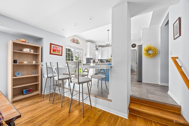 849 Brompton Cir, Bolingbrook, IL 60440 - dining space with light wood-type flooring, baseboards, and recessed lighting