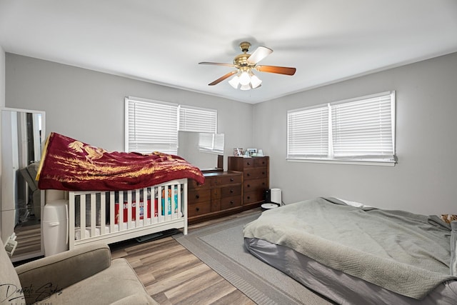 16121 S Harmony Dr, Plainfield, IL 60586 - bedroom featuring a ceiling fan and wood finished floors