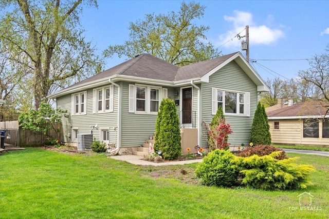 309 E Elm St, Villa Park, IL 60181 - view of front facade with central AC, fence, and a front lawn
