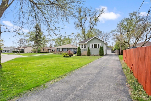 309 E Elm St, Villa Park, IL 60181 - view of front of property featuring a garage, fence, driveway, and a front yard