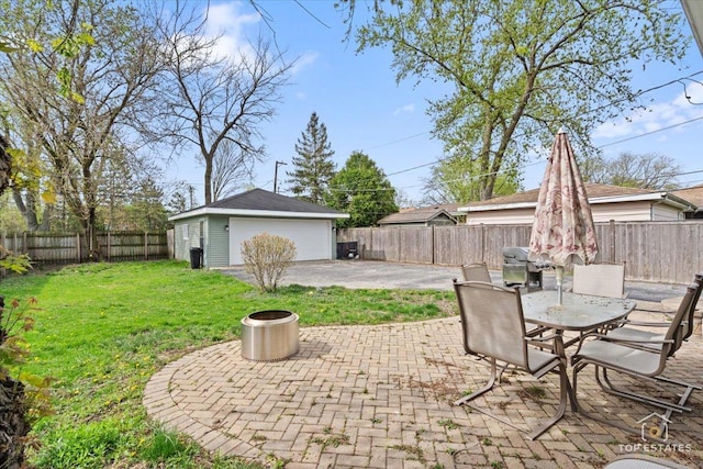 309 E Elm St, Villa Park, IL 60181 - view of patio featuring outdoor dining area, a garage, a fenced backyard, and an outbuilding