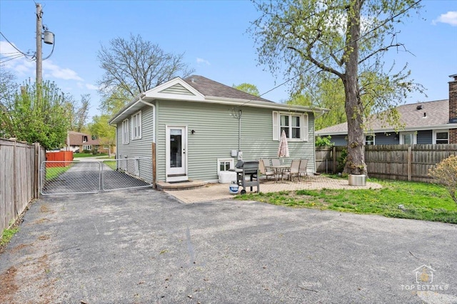 309 E Elm St, Villa Park, IL 60181 - rear view of property featuring entry steps, a gate, fence private yard, and a patio area