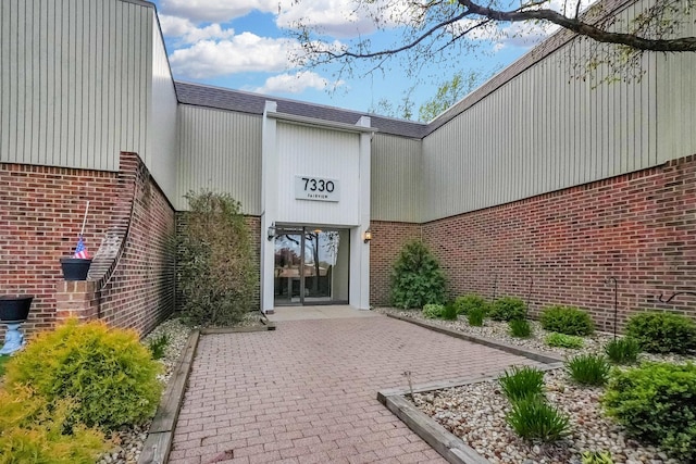 7330 Fairview Ave Unit 104, Downers Grove, IL 60516 - doorway to property with brick siding