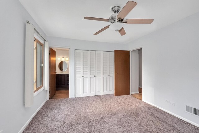 7330 Fairview Ave Unit 104, Downers Grove, IL 60516 - unfurnished bedroom with visible vents, baseboards, a closet, connected bathroom, and carpet flooring