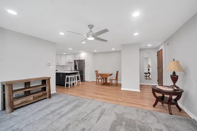 7330 Fairview Ave Unit 104, Downers Grove, IL 60516 - living area with baseboards, a ceiling fan, recessed lighting, and light wood-style flooring