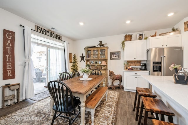 dining room featuring dark wood-type flooring and recessed lighting