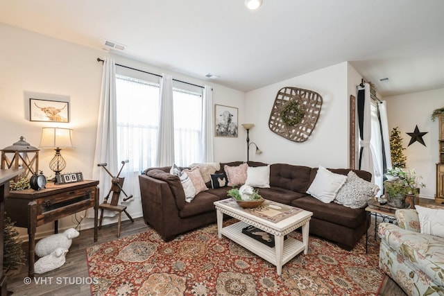 living area with wood finished floors and baseboards
