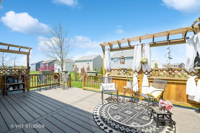 wooden deck with a pergola and a residential view