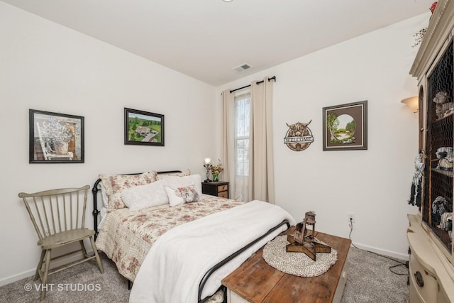 carpeted bedroom featuring baseboards
