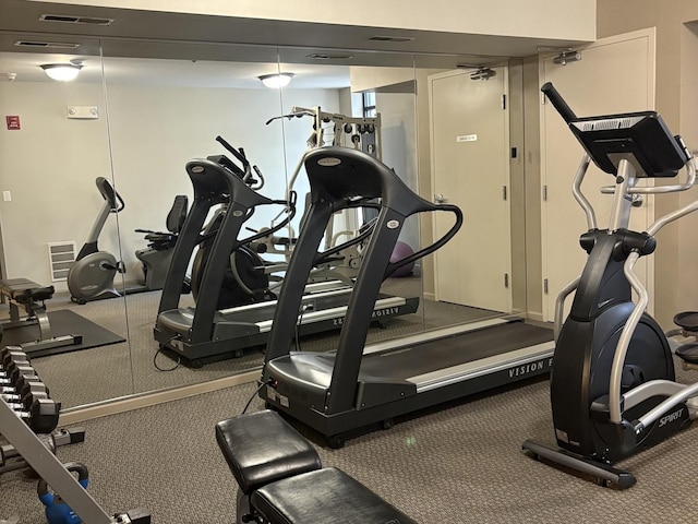 exercise room featuring visible vents