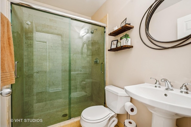 521 N Racine Ave Unit 3, Chicago, IL 60642 - bathroom with toilet, a stall shower, and a sink