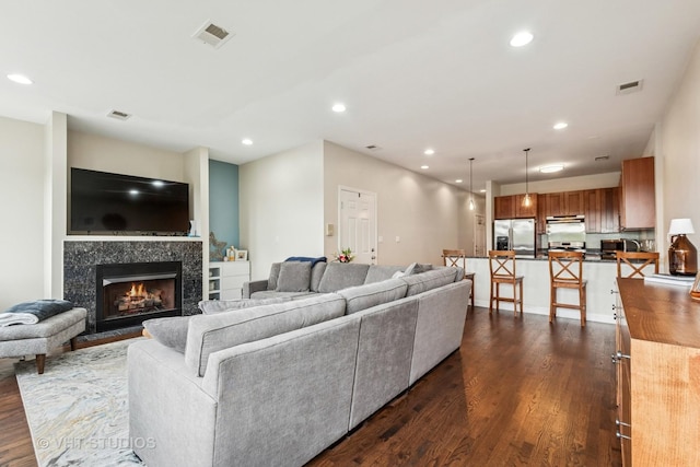 521 N Racine Ave Unit 3, Chicago, IL 60642 - living room with dark wood-type flooring, a fireplace, and recessed lighting
