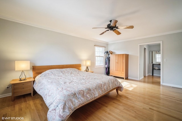 3935 Russett Ln, Northbrook, IL 60062 - bedroom featuring crown molding, a ceiling fan, baseboards, wood finished floors, and visible vents