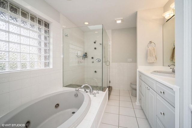 3935 Russett Ln, Northbrook, IL 60062 - bathroom featuring vanity, toilet, a whirlpool tub, tile patterned floors, and a shower stall