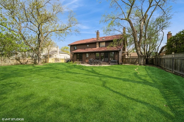 3935 Russett Ln, Northbrook, IL 60062 - back of house with a lawn, a fenced backyard, and a patio area