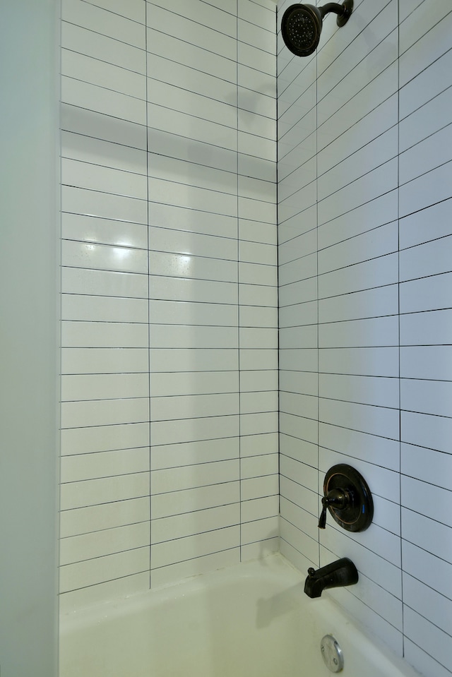 room details featuring shower / washtub combination