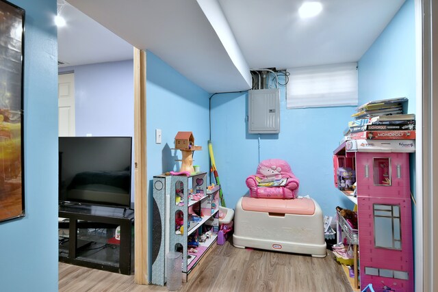 interior space featuring wood finished floors and electric panel