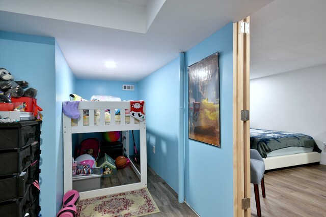 bedroom featuring wood finished floors